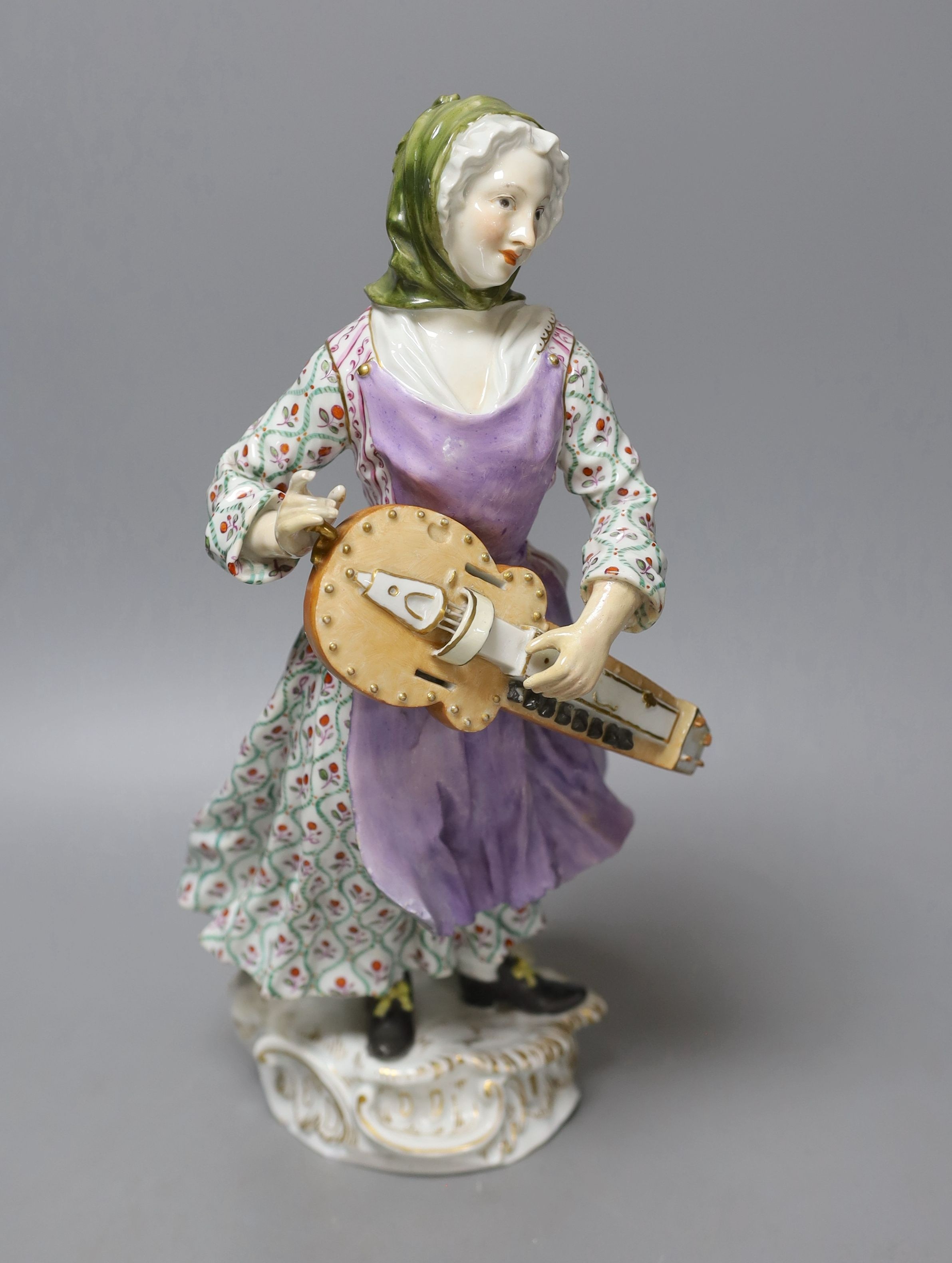 A large Meissen figure of a female hurdy gurdy player, 19th century - 33cm tall